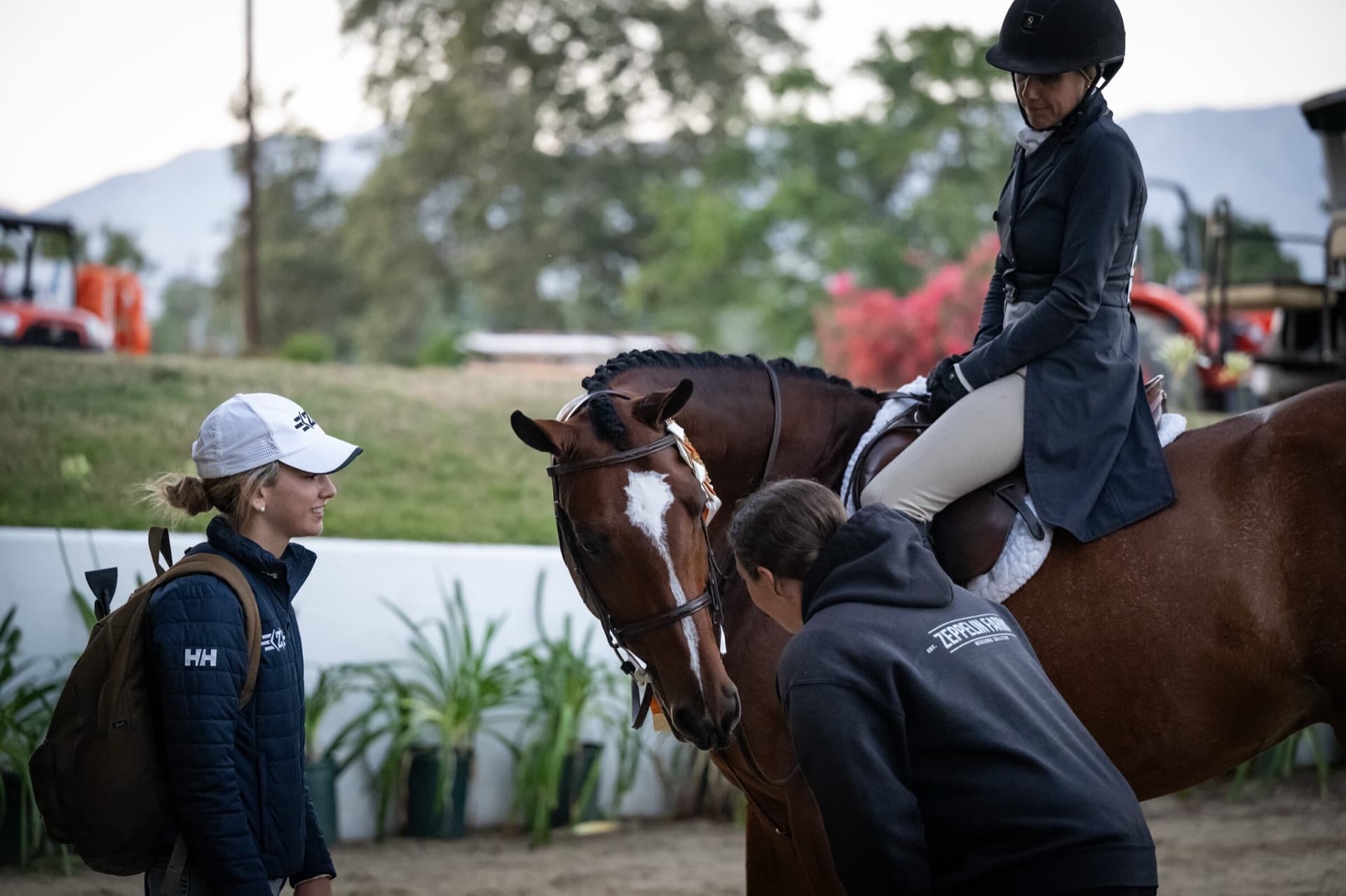 A Zeppelin Farms trainer coaching ringside