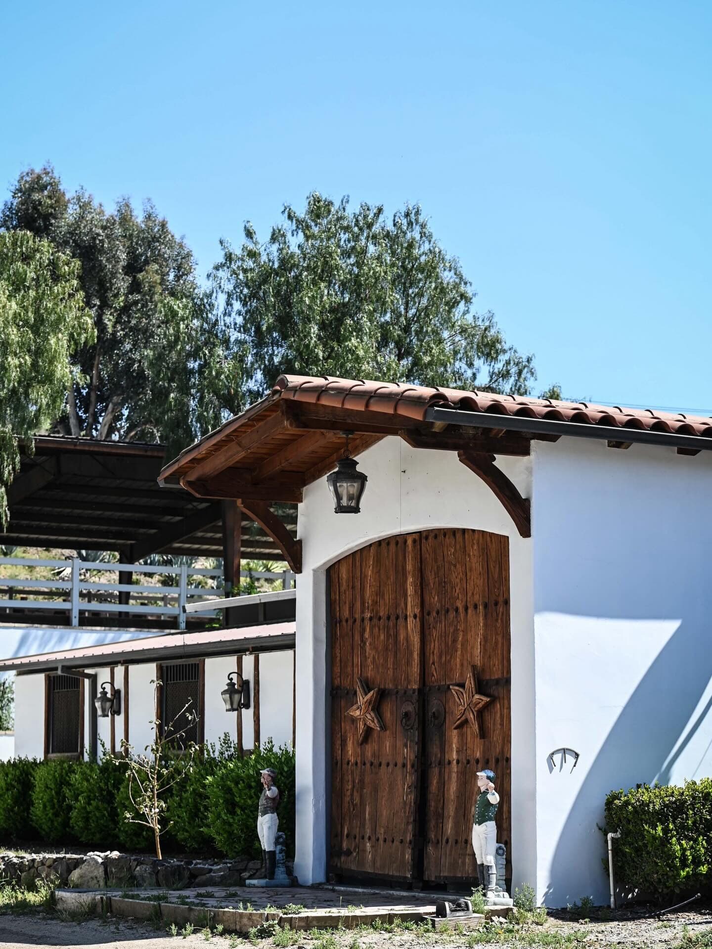 The Spanish-style barn entrance at 21 Mile Ranch